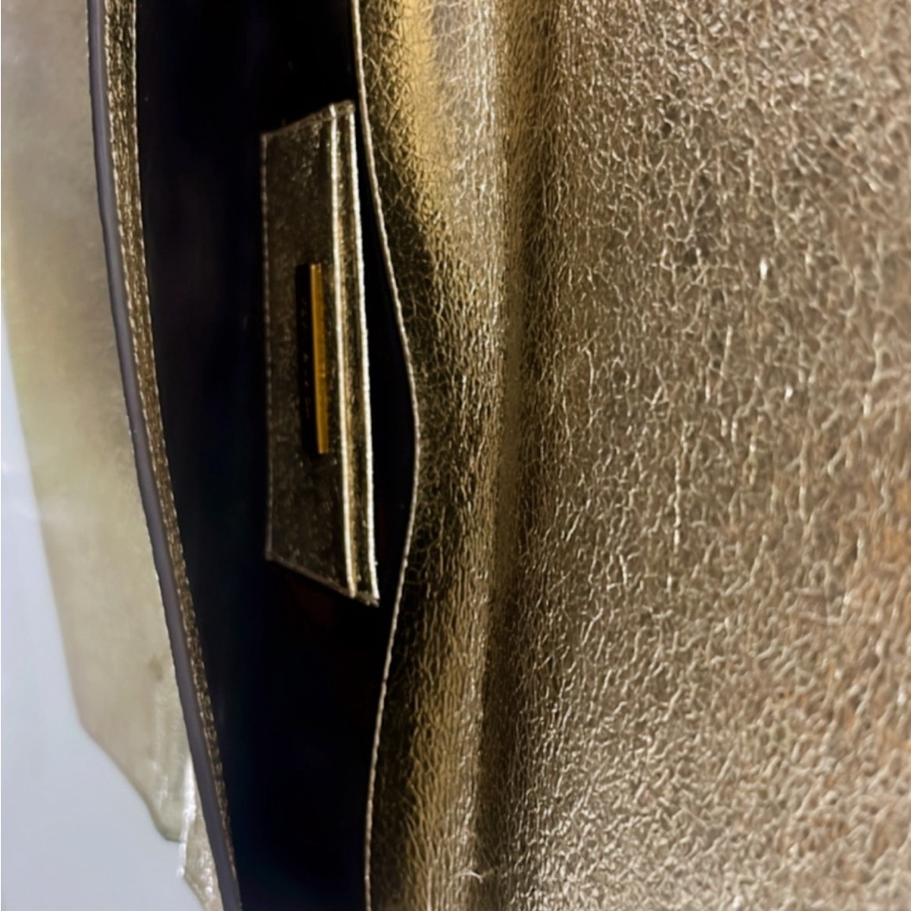 TB metallic champagne color clutch in mint condition. Like new! Stylish!! - Picture 3 of 4